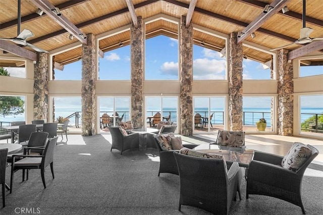 view of patio featuring a water view, ceiling fan, and a gazebo