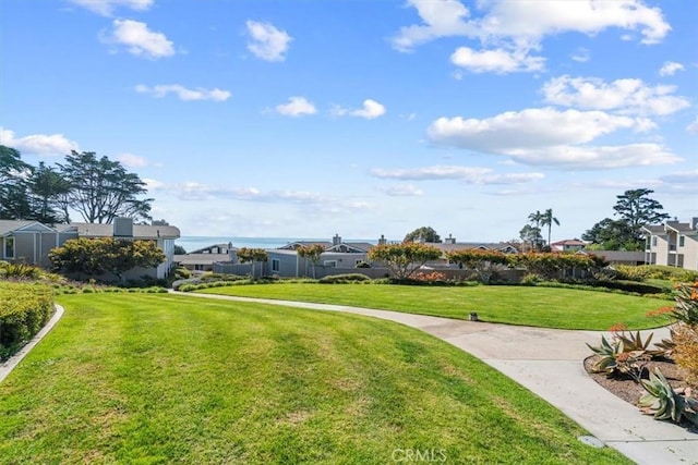 view of home's community with a lawn