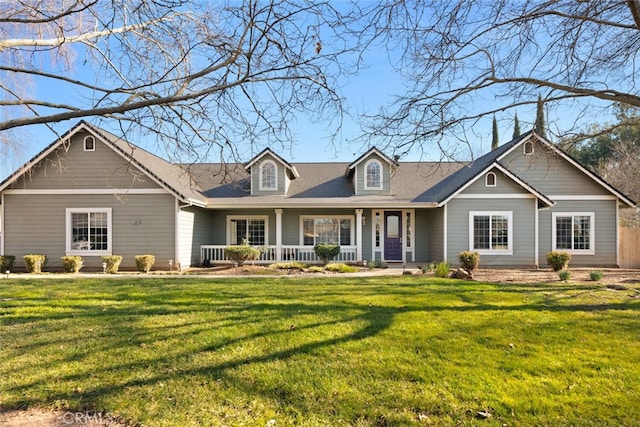 view of front of house with a front yard and a porch