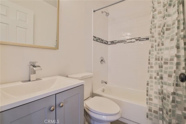 full bathroom featuring vanity, toilet, and shower / bath combo with shower curtain