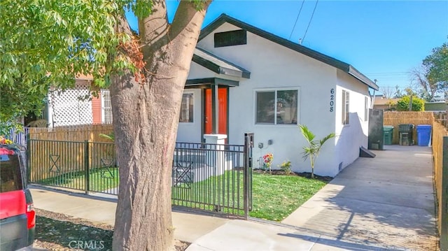 bungalow with a front yard