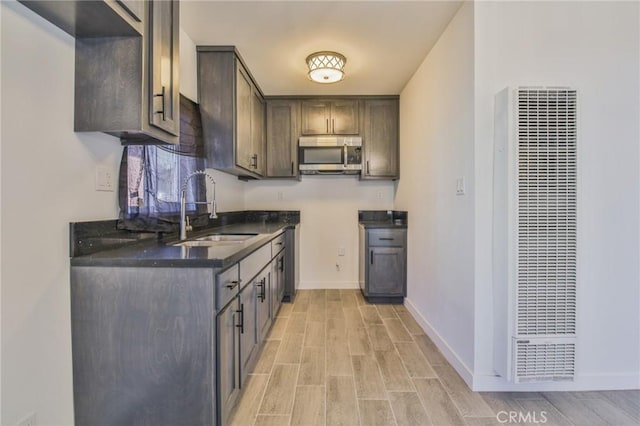 kitchen with sink and dark brown cabinets