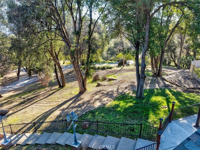 view of home's community featuring a lawn