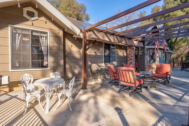 view of patio featuring a fire pit and a pergola