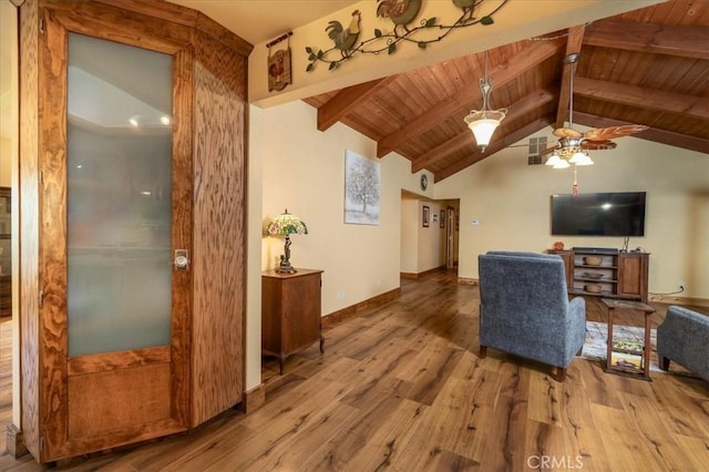 living room featuring vaulted ceiling with beams, ceiling fan, wood ceiling, and light wood-type flooring