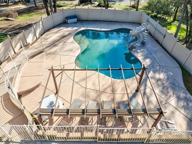 view of swimming pool with a patio area