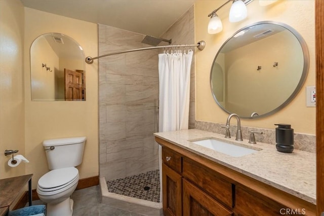 bathroom featuring vanity, toilet, curtained shower, and tile patterned flooring