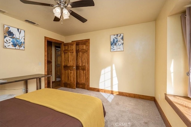 bedroom featuring ceiling fan and carpet