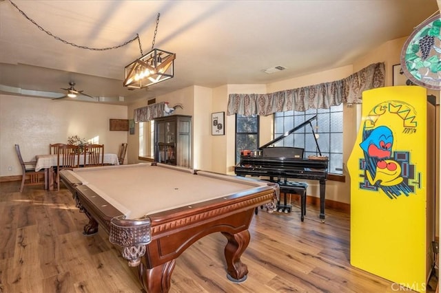 game room with hardwood / wood-style floors, billiards, and ceiling fan