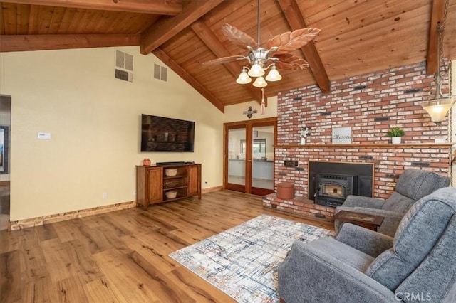 living room featuring ceiling fan, light hardwood / wood-style flooring, wooden ceiling, and beamed ceiling