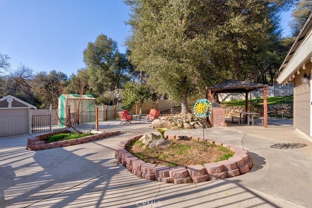 view of yard with a gazebo, a patio, and a playground