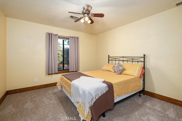 bedroom featuring ceiling fan and carpet