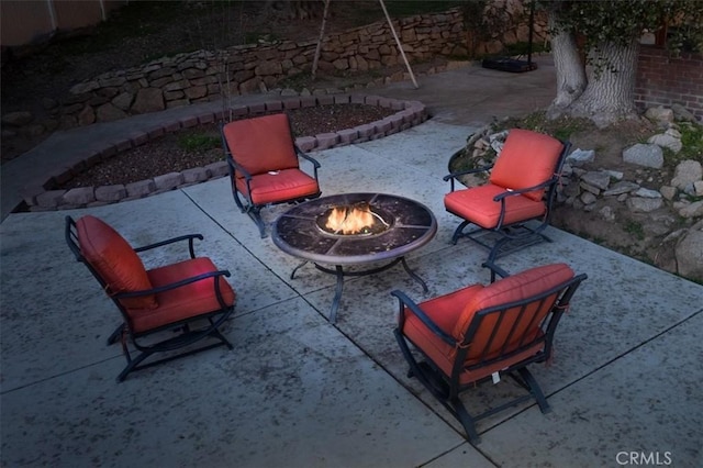 view of patio featuring a fire pit