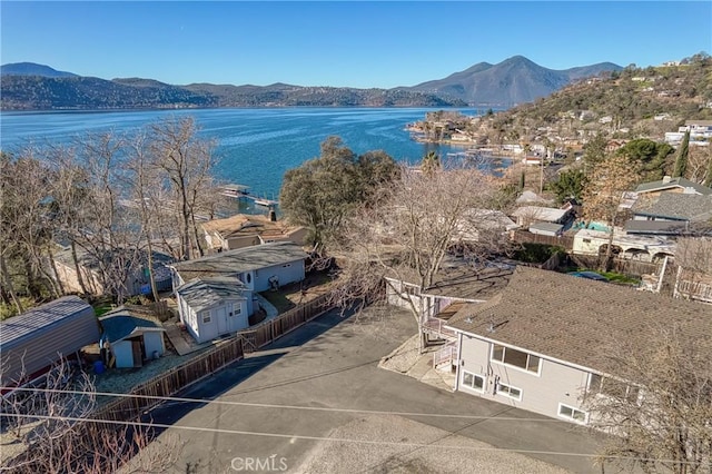 drone / aerial view featuring a water and mountain view