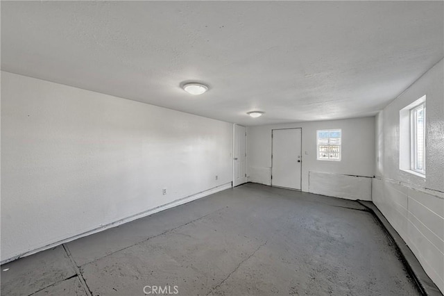 empty room featuring concrete flooring