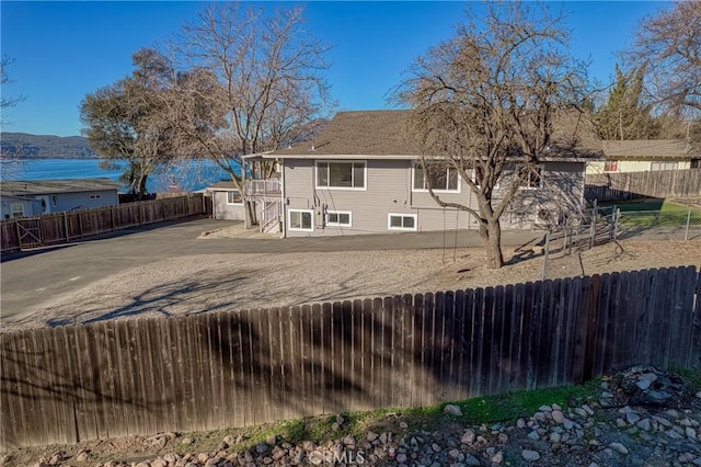 rear view of house with a water view