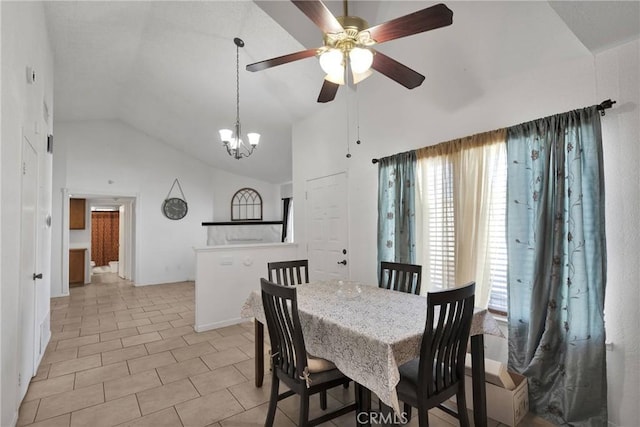 dining room with a healthy amount of sunlight, light tile patterned floors, and high vaulted ceiling