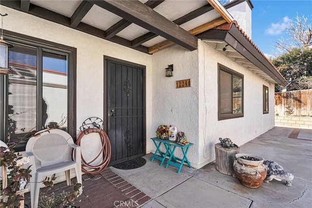 doorway to property with a patio