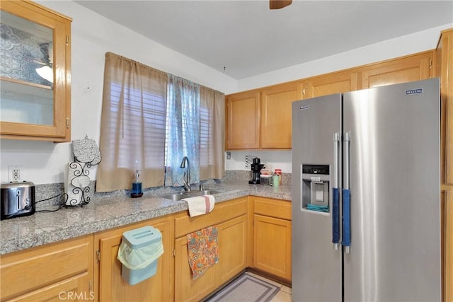 kitchen with high end fridge and sink