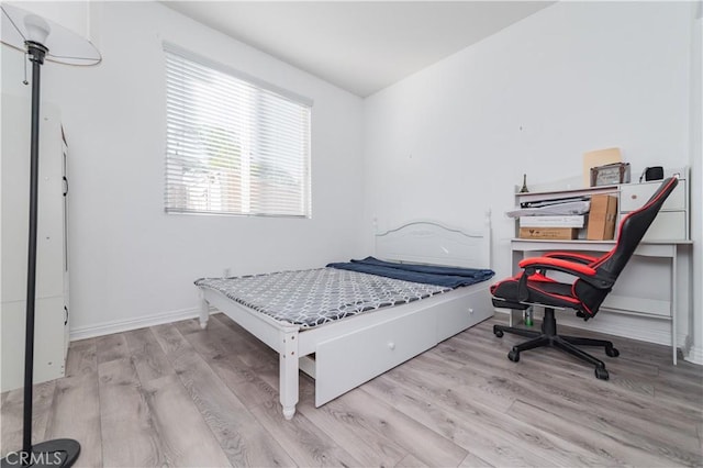 bedroom featuring light hardwood / wood-style floors