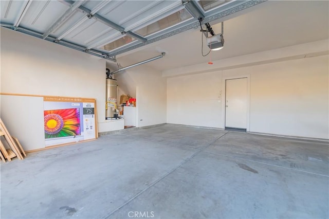 garage with a garage door opener and water heater