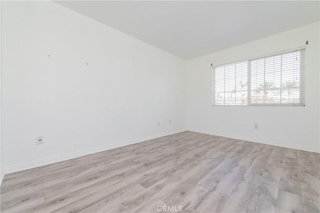 unfurnished room with light hardwood / wood-style flooring