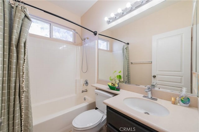 full bathroom featuring shower / bath combo, vanity, and toilet