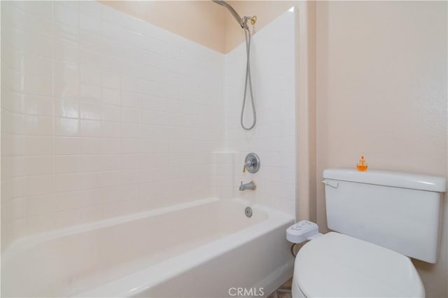 bathroom featuring bathing tub / shower combination and toilet