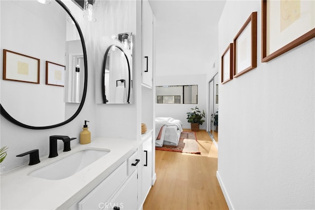 bathroom featuring vanity and hardwood / wood-style floors