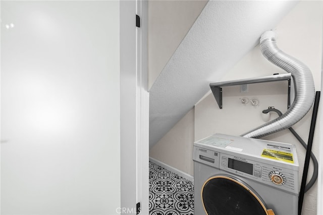 washroom featuring tile patterned floors and washer / dryer