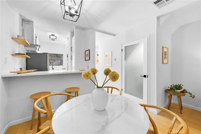 dining room with light hardwood / wood-style flooring