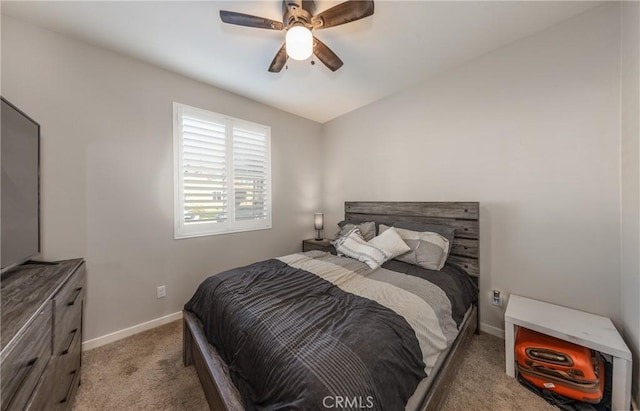 bedroom featuring ceiling fan, carpet flooring, and baseboards