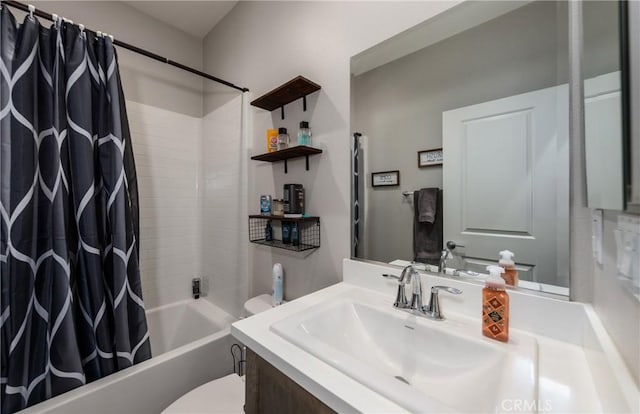 bathroom with shower / tub combo, vanity, and toilet