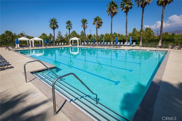 view of pool featuring a gazebo and a patio