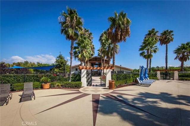 surrounding community with a patio area