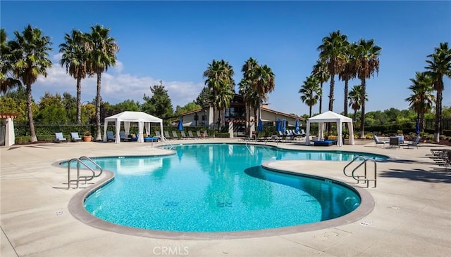 view of swimming pool featuring a gazebo and a patio