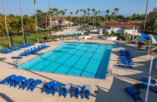 community pool featuring a patio area