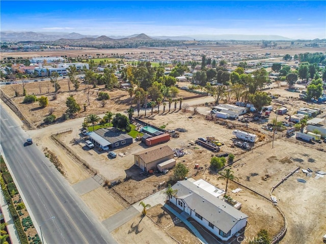 birds eye view of property with a mountain view