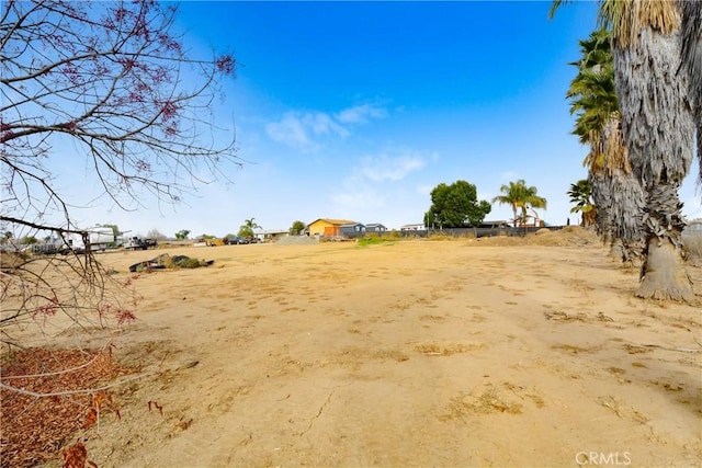 view of yard with a rural view