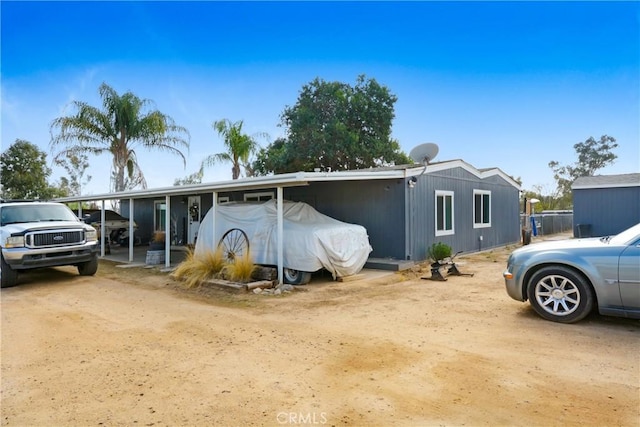 view of front of home with a carport