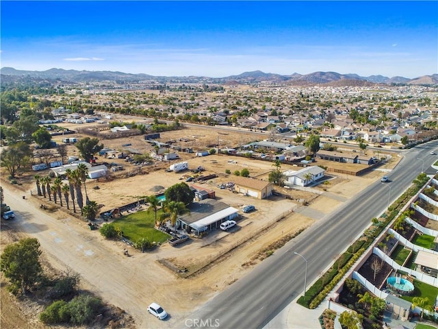 birds eye view of property with a mountain view