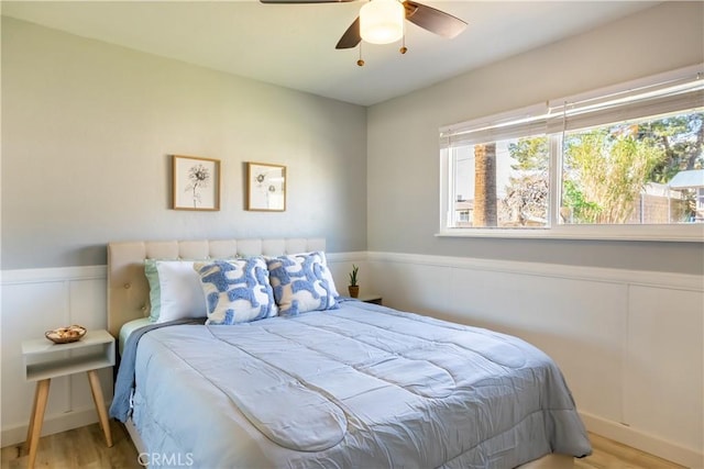 bedroom featuring ceiling fan and light hardwood / wood-style floors