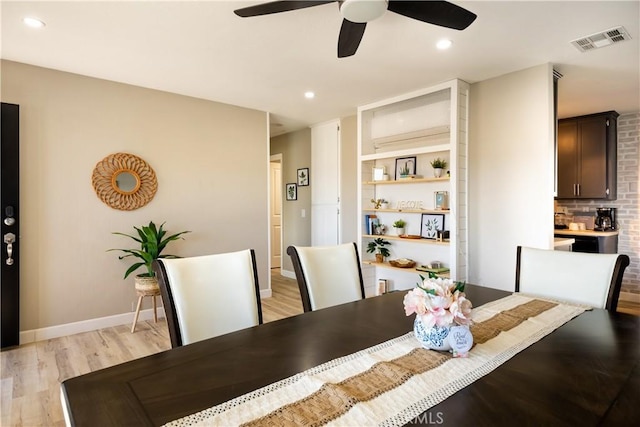 dining space with ceiling fan and light hardwood / wood-style floors