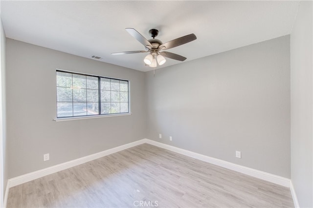 unfurnished room with ceiling fan and light hardwood / wood-style flooring