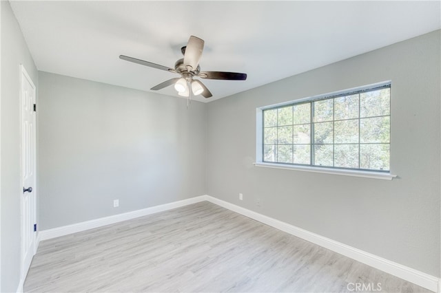 unfurnished room with ceiling fan and light hardwood / wood-style floors