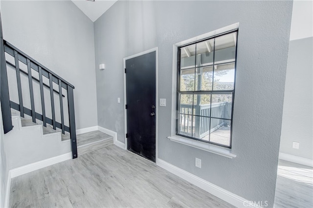 entrance foyer featuring a healthy amount of sunlight and light wood-type flooring