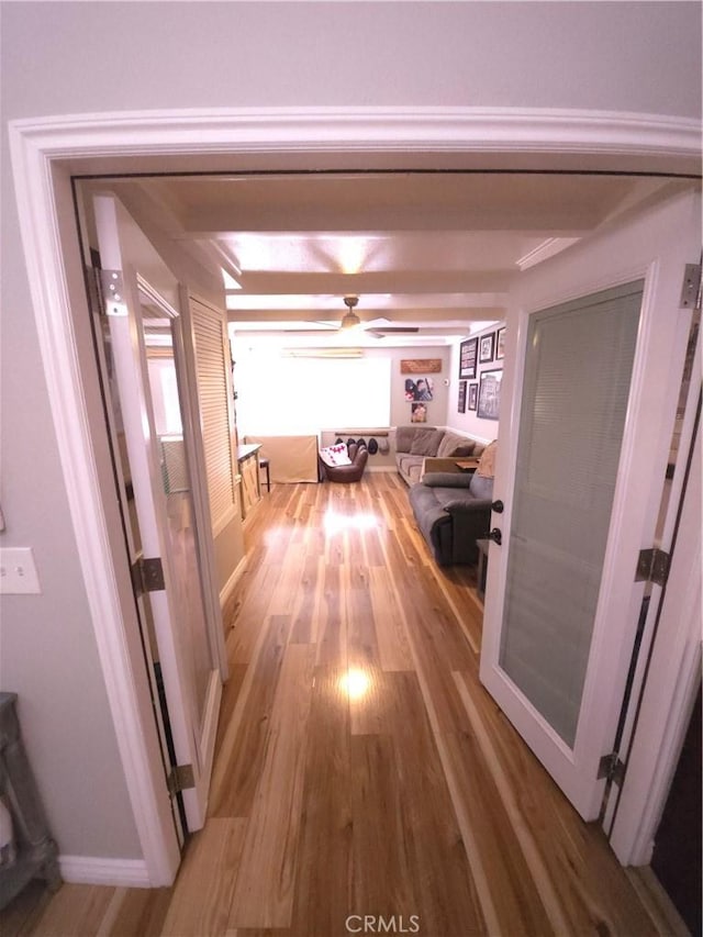 hall with hardwood / wood-style floors