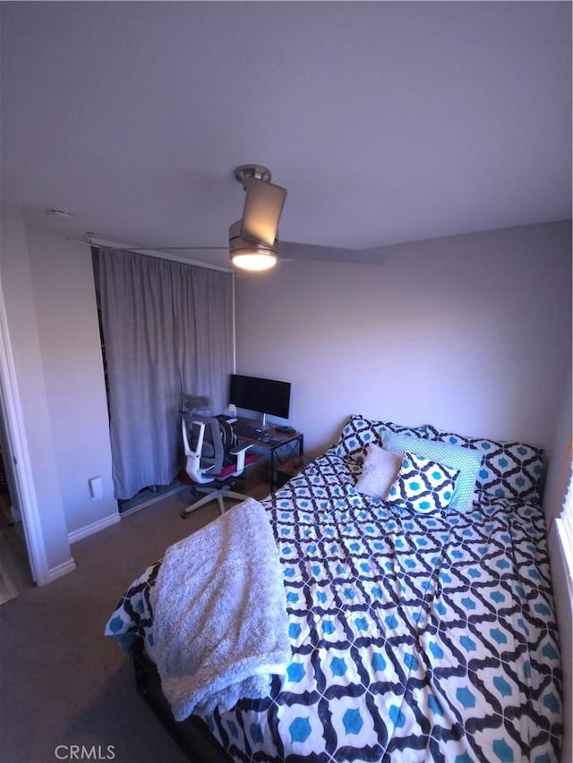 bedroom with ceiling fan and carpet