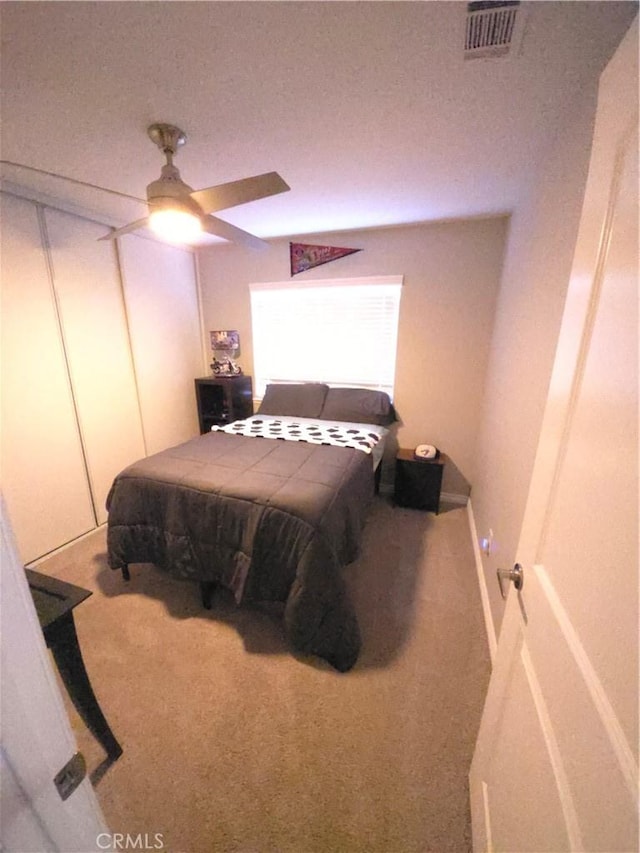 carpeted bedroom featuring ceiling fan