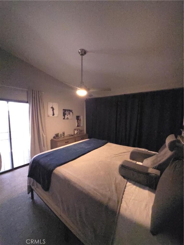 carpeted bedroom with lofted ceiling and ceiling fan